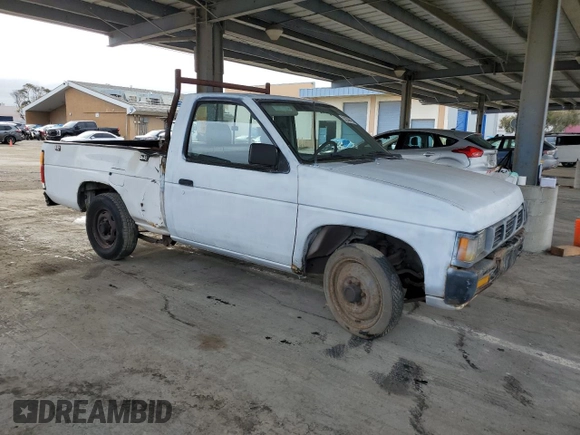 1995 Nissan Frontier with VIN 1N6SD11S3SC379478, listed as a Copart auction lot 52209415 with 21,068 mi miles and Salvage title. Bid and sale history available at DreamBid. Image 4.
