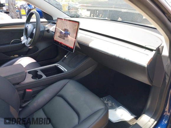 2022 Tesla Model 3 Long Range z VIN 5YJ3E1EB7NF180049, wystawiony jako IAAI lot #42188963 z przebiegiem 18 604 mil mil oraz . Historia ofert i sprzedaży dostępna na DreamBid. Obrazek 5.