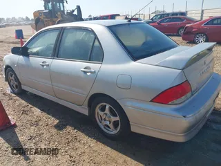 2003 Mitsubishi Lancer OZ-Rally with VIN JA3AJ86E23U069464, listed as a IAAI auction lot 41775000 with 148,735 mi miles. Bid and sale history available at carsss.com. Image 3.