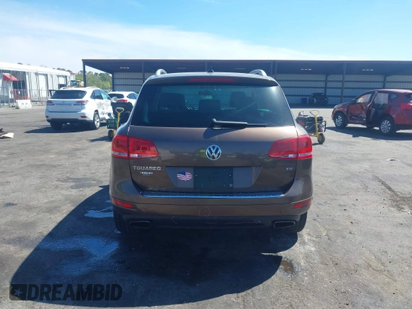 2014 Volkswagen Touareg Sport with VIN WVGEF9BP7ED003525, listed as a IAAI auction lot 41868307 with 74,379 mi miles and . Bid and sale history available at DreamBid. Image 16.