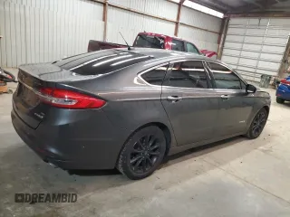 2017 Ford Fusion Hybrid SE z VIN 3FA6P0LU4HR226127, wystawiony jako Copart lot #50496455 z przebiegiem 98 027 mil mil oraz Szkoda całkowita • Salvage title. Historia ofert i sprzedaży dostępna na DreamBid. Obrazek 3.