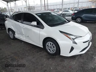 2016 Toyota Prius Two z VIN JTDKBRFU5G3015989, wystawiony jako IAAI lot #41511612 z przebiegiem 158 903 mil mil oraz . Historia ofert i sprzedaży dostępna na DreamBid. Obrazek 1.