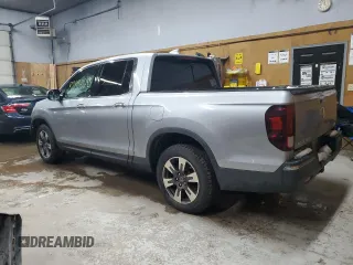 2017 Honda Ridgeline RTL-E with VIN 5FPYK3F71HB030020, listed as a Copart auction lot 82834683 with 102,111 mi miles and Salvage title. Bid and sale history available at DreamBid. Image 2.