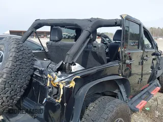 2015 Jeep Wrangler Unlimited Rubicon z VIN 1C4BJWFG7FL711036, wystawiony jako IAAI lot #41604648 z przebiegiem 167 678 mil mil oraz . Historia ofert i sprzedaży dostępna na DreamBid. Obrazek 14.