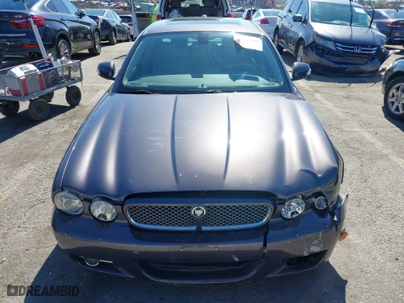 2008 Jaguar XJ with VIN SAJWA71B68SH22853, listed as a IAAI auction lot 41678688 with 76,367 mi miles. Bid and sale history available at carsss.com. Image 12.