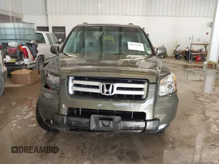 2006 Honda Pilot EX-L with VIN 5FNYF187X6B026463, listed as a IAAI auction lot 41612181 with 242,828 mi miles and . Bid and sale history available at DreamBid. Image 12.