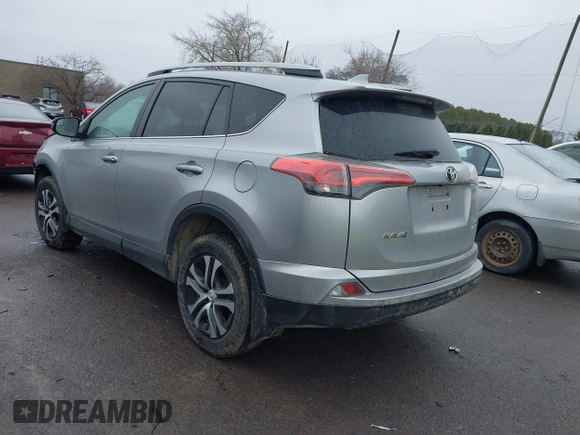 2018 Toyota RAV4 LE with VIN 2T3BFREVXJW717079, listed as a IAAI auction lot 42001580 with 96,044 mi miles. Bid and sale history available at carsss.com. Image 3.