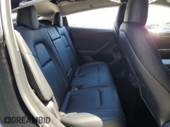 2022 Tesla Model Y Performance z VIN 7SAYGDEF0NF540933, wystawiony jako Copart lot #56087145 z przebiegiem 59 717 mil mil oraz Szkoda całkowita • Salvage title. Historia ofert i sprzedaży dostępna na DreamBid. Obrazek 10.