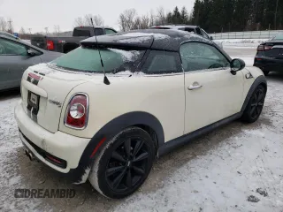 2013 MINI Coupe S z VIN WMWSX3C56DT772517, wystawiony jako Copart lot #83702084 z przebiegiem 106 910 mil mil oraz Tytuł czysty. Historia ofert i sprzedaży dostępna na DreamBid. Obrazek 3.