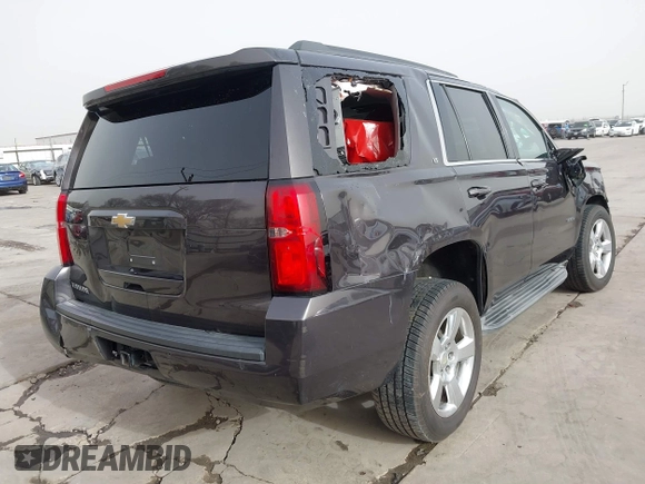 2015 Chevrolet Tahoe LT with VIN 1GNSCBKC5FR504459, listed as a IAAI auction lot 41689405 with 141,783 mi miles and . Bid and sale history available at DreamBid. Image 4.