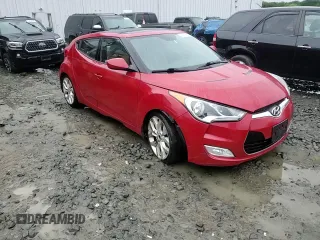 2013 Hyundai Veloster w/Gray Int z VIN KMHTC6AD0DU147454, wystawiony jako Copart lot #57814285 z przebiegiem 91 000 mil mil oraz Szkoda całkowita • Salvage title. Historia ofert i sprzedaży dostępna na DreamBid. Obrazek 13.