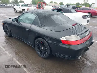 2005 Porsche 911 Carrera z VIN WP0CA299X5S650179, wystawiony jako IAAI lot #42123937 z przebiegiem 52 437 mil mil oraz . Historia ofert i sprzedaży dostępna na DreamBid. Obrazek 3.