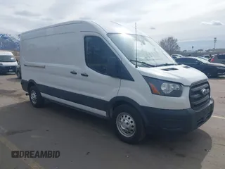 2020 Ford Transit Cargo z VIN 1FTBR2CG1LKB43034, wystawiony jako IAAI lot #41668193 z przebiegiem 56 827 mil mil oraz . Historia ofert i sprzedaży dostępna na DreamBid. Obrazek 1.