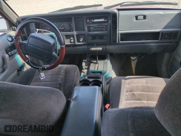 1996 Jeep Cherokee Sport with VIN 1J4FJ68S6TL171056, listed as a Copart auction lot 52099555 with 250,089 mi miles and Salvage Title. Bid and sale history available at carsss.com. Image 8.