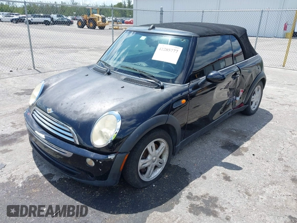 2006 MINI Convertible with VIN WMWRF33566TG15464, listed as a IAAI auction lot 42285777 with 144,430 mi miles and . Bid and sale history available at DreamBid. Image 2.
