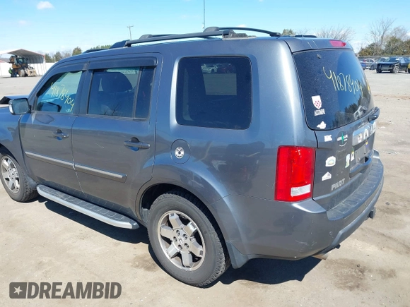 2011 Honda Pilot Touring with VIN 5FNYF4H95BB090892, listed as a IAAI auction lot 41878404 with 131,757 mi miles. Bid and sale history available at carsss.com. Image 3.