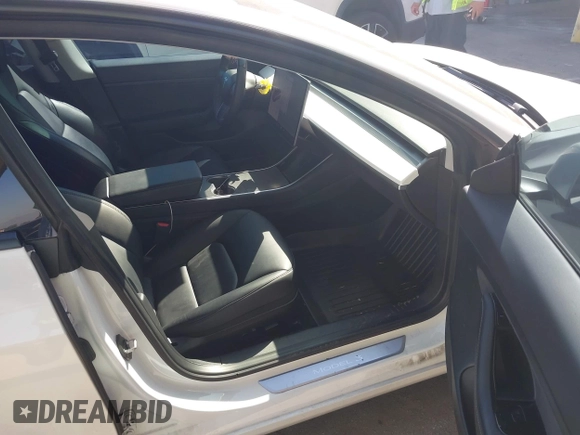 2020 Tesla Model 3 Standard Range Plus with VIN 5YJ3E1EA1LF659765, listed as a IAAI auction lot 41834411 with 42,433 mi miles and . Bid and sale history available at carsss.com. Image 5.