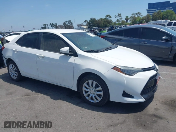 2018 Toyota Corolla L with VIN 5YFBURHE7JP810444, listed as a IAAI auction lot 42558647 with 74,794 mi miles and . Bid and sale history available at DreamBid. Image 1.