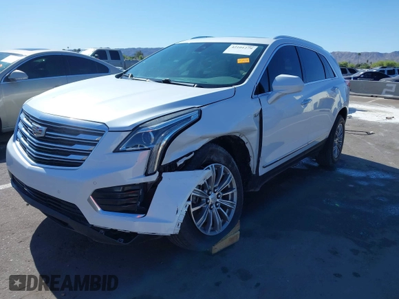 2017 Cadillac XT5 Luxury AWD z VIN 1GYKNDRS8HZ120863, wystawiony jako IAAI lot #42101279 z przebiegiem 100 535 mil mil oraz . Historia ofert i sprzedaży dostępna na DreamBid. Obrazek 18.
