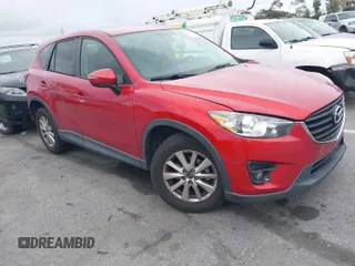 2016 Mazda CX-5 Touring with VIN JM3KE2CY3G0877185, listed as a IAAI auction lot 41729243 with 144,656 mi miles. Bid and sale history available at carsss.com. Image 1.