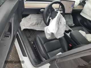 2021 Tesla Model 3 Standard Range Plus z VIN 5YJ3E1EA2MF859832, wystawiony jako Copart lot #56743865 z przebiegiem 77 025 mil mil oraz Nie do naprawy. Historia ofert i sprzedaży dostępna na DreamBid. Obrazek 8.
