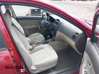 2009 Kia Spectra EX with VIN KNAFE222195661572, listed as a IAAI auction lot 42148750 with 137,773 mi miles. Bid and sale history available at carsss.com. Image 5.