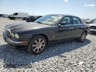 2004 Jaguar XJ with VIN SAJEA71C14SG10928, listed as a Copart auction lot 51202785 with 164,300 mi miles and Salvage Title. Bid and sale history available at carsss.com. Image 1.