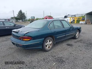 1998 Pontiac Bonneville SE with VIN 1G2HX52K0W4211117, listed as a IAAI auction lot 42125471 with 187,249 mi miles. Bid and sale history available at carsss.com. Image 4.