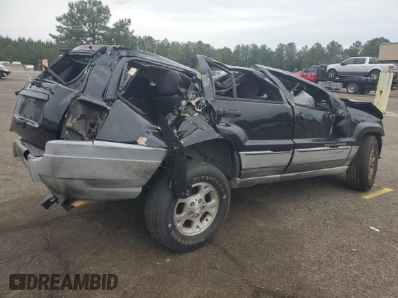 2000 Jeep Grand Cherokee Laredo with VIN 1J4G248S4YC390675, listed as a Copart auction lot 55652815 with Not provided miles and Salvage title. Bid and sale history available at DreamBid. Image 3.