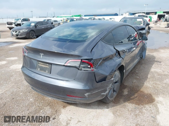2023 Tesla Model 3 with VIN 5YJ3E1EA5PF676316, listed as a IAAI auction lot 42384765 with 33,715 mi miles and . Bid and sale history available at DreamBid. Image 4.