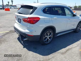 2017 BMW X1 xDrive28i with VIN WBXHT3C33H5F86831, listed as a IAAI auction lot 42019082 with 74,708 mi miles and . Bid and sale history available at DreamBid. Image 4.