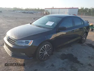 2016 Volkswagen Jetta Sport z VIN 3VWD17AJ5GM335337, wystawiony jako IAAI lot #42081987 z przebiegiem 93 215 mil mil oraz . Historia ofert i sprzedaży dostępna na DreamBid. Obrazek 18.