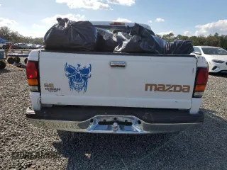 1999 Mazda B-Series 2WD Truck SX with VIN 4F4YR12C4XTM40289, listed as a Copart auction lot 77544354 with 192,046 mi miles and Salvage Title. Bid and sale history available at carsss.com. Image 6.
