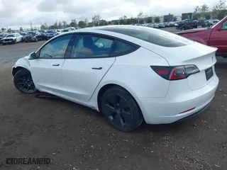 2023 Tesla Model 3 with VIN 5YJ3E1EA4PF405361, listed as a IAAI auction lot 41932723 with 28,487 mi miles. Bid and sale history available at carsss.com. Image 3.