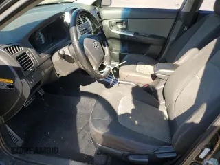 2009 Kia Spectra SX with VIN KNAFE221895022564, listed as a Copart auction lot 76997864 with 189,177 mi miles and Salvage Title. Bid and sale history available at carsss.com. Image 7.
