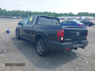 2023 Honda Ridgeline RTL-E with VIN 5FPYK3F71PB022739, listed as a IAAI auction lot 42447428 with 19,702 mi miles and . Bid and sale history available at DreamBid. Image 3.