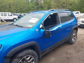 2021 Jeep Cherokee Trailhawk with VIN 1C4PJMBXXMD173102, listed as a IAAI auction lot 42205402 with 57,321 mi miles and . Bid and sale history available at DreamBid. Image 6.