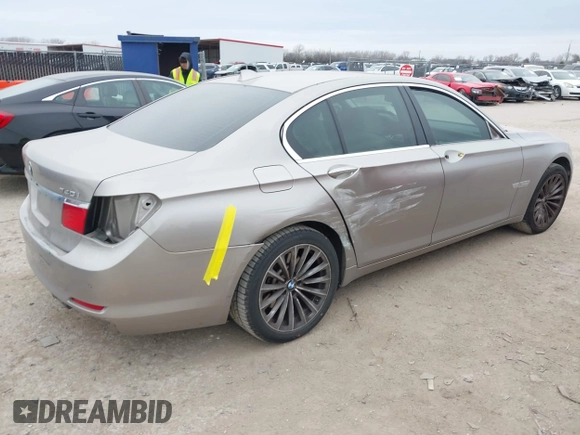 2012 BMW 7 Series 740i with VIN WBAKA4C51CC613670, listed as a IAAI auction lot 41582639 with 149,753 mi miles. Bid and sale history available at carsss.com. Image 4.