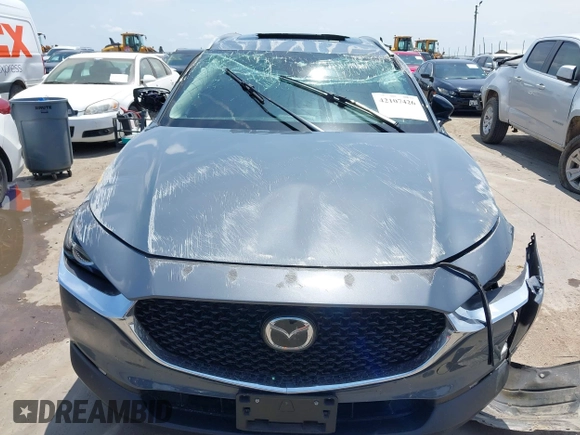 2022 Mazda CX-30 S Carbon Edition with VIN 3MVDMBCL6NM410330, listed as a IAAI auction lot 42107426 with 30,277 mi miles and . Bid and sale history available at DreamBid. Image 13.