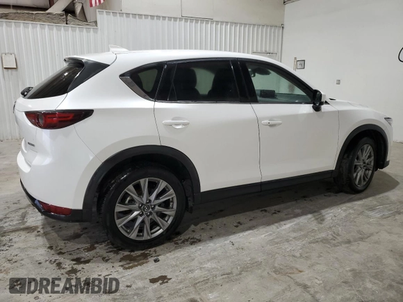 2021 Mazda CX-5 Grand Touring with VIN JM3KFBDM4M1344602, listed as a Copart auction lot 82793724 with 69,322 mi miles and Salvage Title. Bid and sale history available at carsss.com. Image 3.