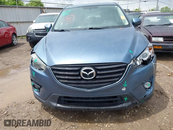 2016 Mazda CX-5 Touring z VIN JM3KE2CY3G0728968, wystawiony jako IAAI lot #42189174 z przebiegiem 145 977 mil mil oraz . Historia ofert i sprzedaży dostępna na DreamBid. Obrazek 13.