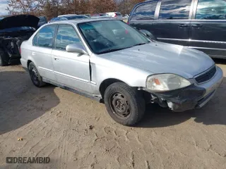 1999 Honda Civic EX with VIN 1HGEJ8648XL012483, listed as a IAAI auction lot 41678562 with 176,661 mi miles. Bid and sale history available at carsss.com. Image 1.