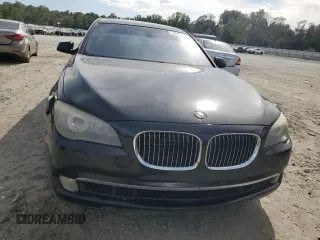 2011 BMW 7 Series with VIN WBAKX8C52BC198377, listed as a Copart auction lot 70003444 with 173,725 mi miles and Salvage title. Bid and sale history available at DreamBid. Image 5.