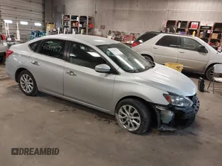 2019 Nissan Sentra S z VIN 3N1AB7AP7KY345072, wystawiony jako IAAI lot #41284957 z przebiegiem 104 084 mil mil oraz . Historia ofert i sprzedaży dostępna na DreamBid. Obrazek 1.