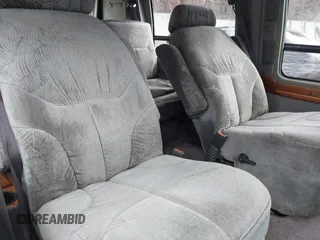 1999 Ford Econoline Cargo z VIN 1FDRE14W1XHA40091, wystawiony jako IAAI lot #41730882 z przebiegiem 221 505 mil mil oraz . Historia ofert i sprzedaży dostępna na DreamBid. Obrazek 8.