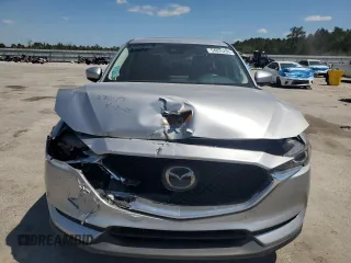 2020 Mazda CX-5 Touring z VIN JM3KFBCM2L1824072, wystawiony jako Copart lot #54825295 z przebiegiem 99 420 mil mil oraz Szkoda całkowita • Salvage title. Historia ofert i sprzedaży dostępna na DreamBid. Obrazek 5.