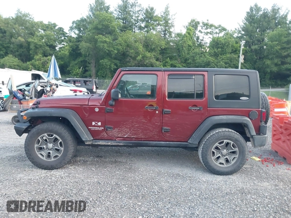 2008 Jeep Wrangler Unlimited X z VIN 1J4GA39128L568988, wystawiony jako IAAI lot #42445403 z przebiegiem 198 032 mil mil oraz . Historia ofert i sprzedaży dostępna na DreamBid. Obrazek 14.