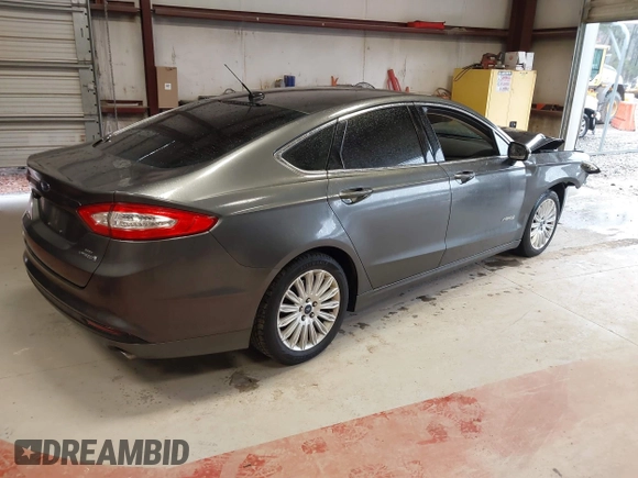 2016 Ford Fusion SE Hybrid with VIN 3FA6P0LU2GR388787, listed as a IAAI auction lot 41733661 with 86,078 mi miles and . Bid and sale history available at DreamBid. Image 4.
