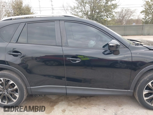 2016 Mazda CX-5 Grand Touring with VIN JM3KE2DY0G0651300, listed as a IAAI auction lot 41678833 with 98,790 mi miles. Bid and sale history available at carsss.com. Image 13.
