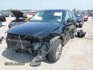 2020 Mazda CX-5 Grand Touring with VIN JM3KFADM1L0781634, listed as a IAAI auction lot 42333769 with 103,080 mi miles and . Bid and sale history available at DreamBid. Image 17.